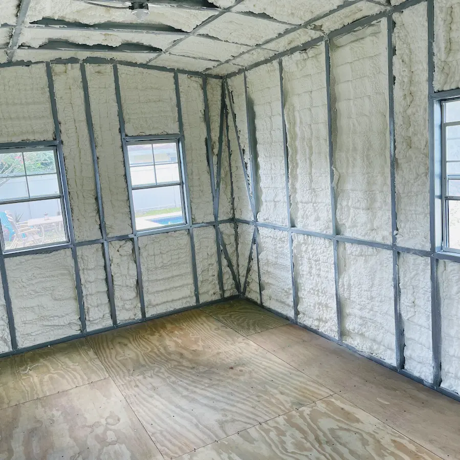 Closed-cell spray foam insulation applied to wall cavities in a residential project in West Greenwich